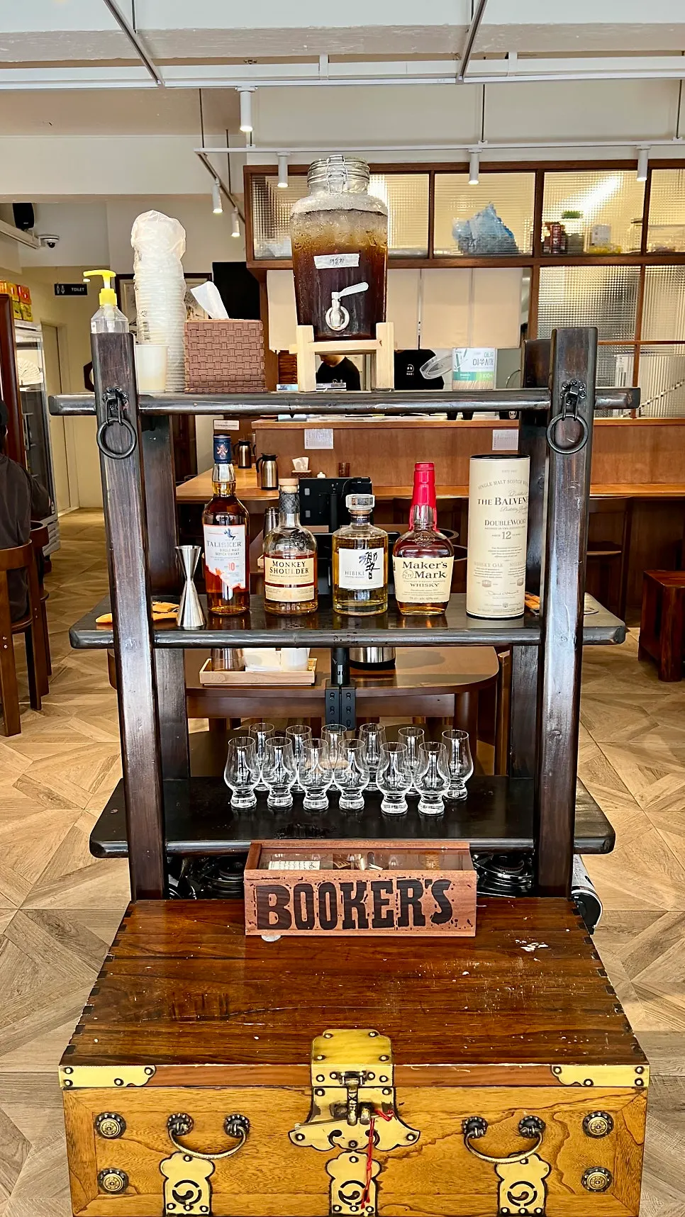 Plum tea and whisky bottles by the entrance