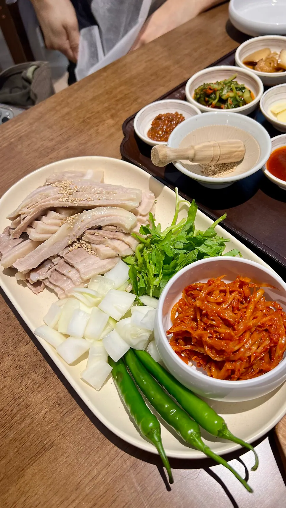 Table with bossam and side dishes