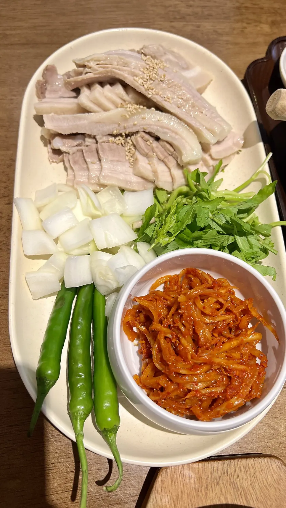 Uldong Bossam plate topped with hangjeongsal boiled pork