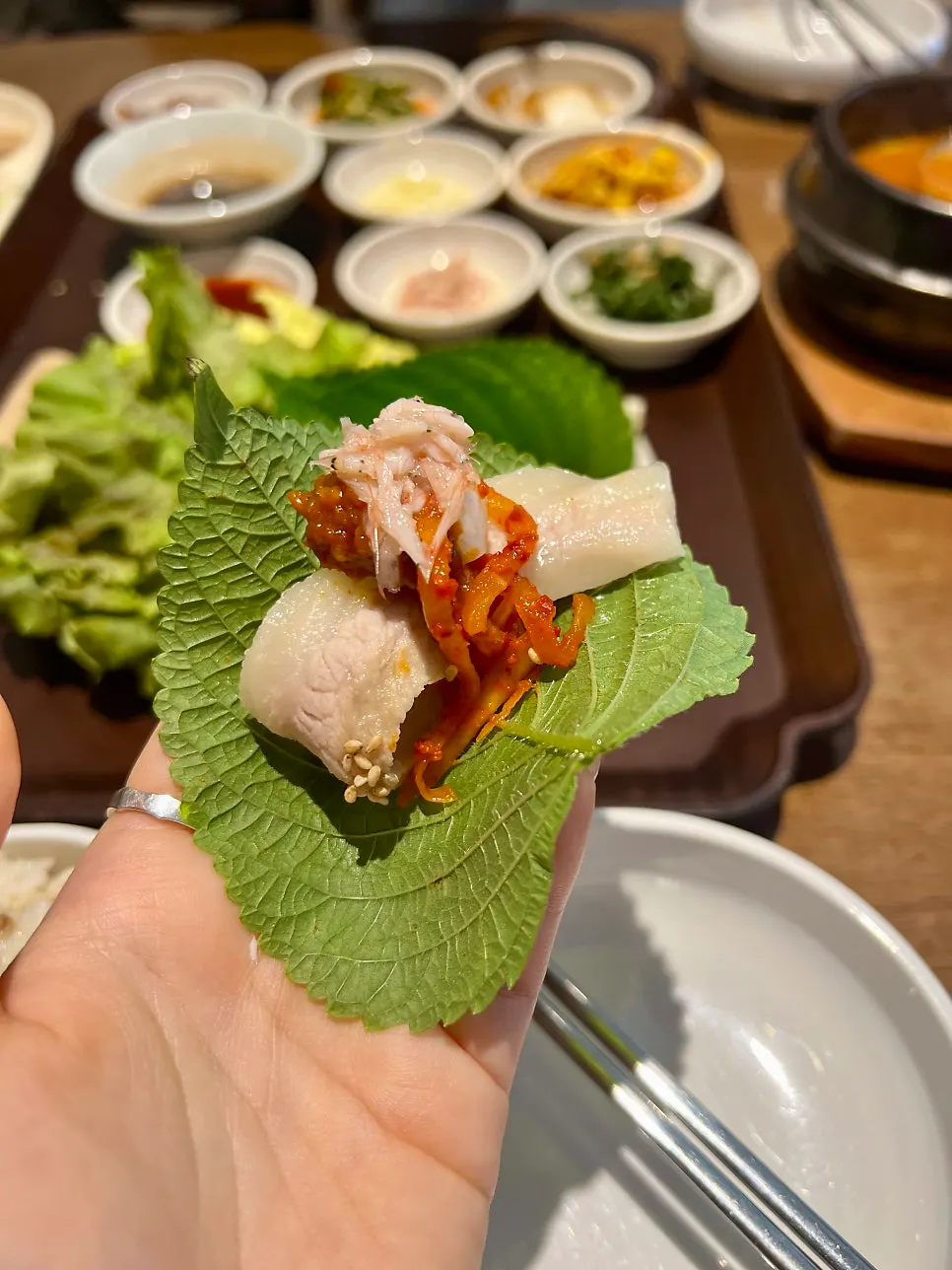 Bossam table spread with makgeolli