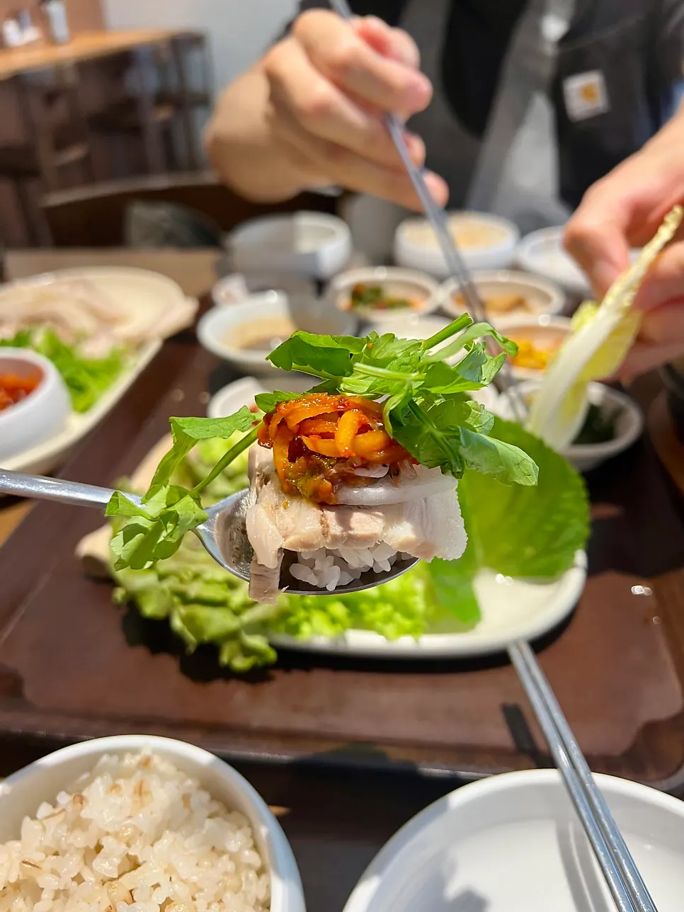 Bossam wrap topped with minari