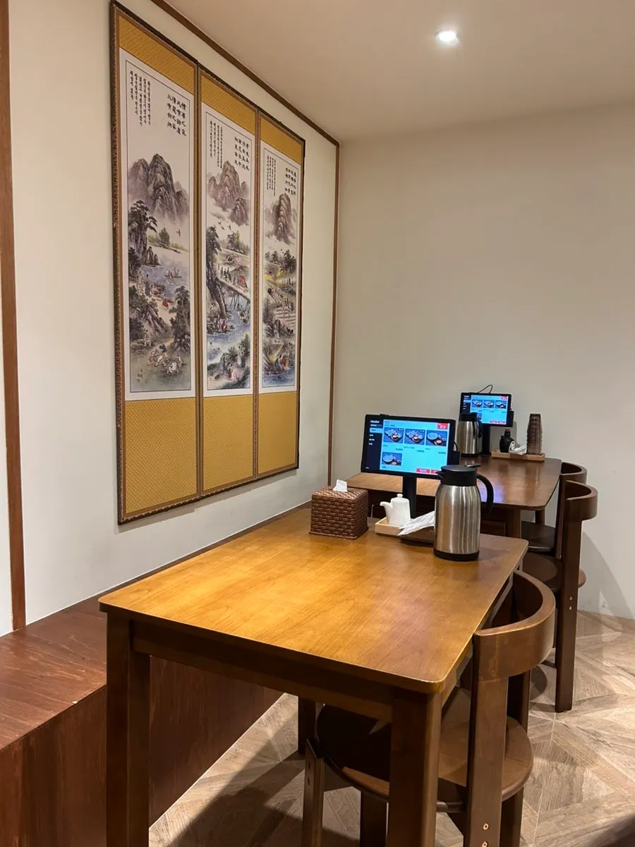 Wooden tables and lighting at Uldong Bossam