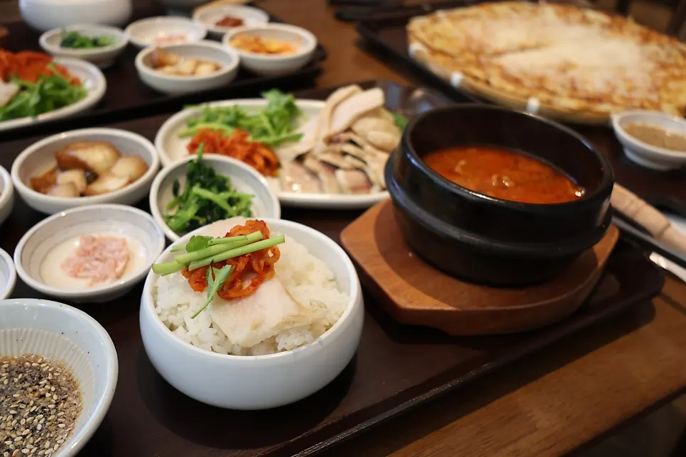 A spoonful of rice topped with meat and radish salad