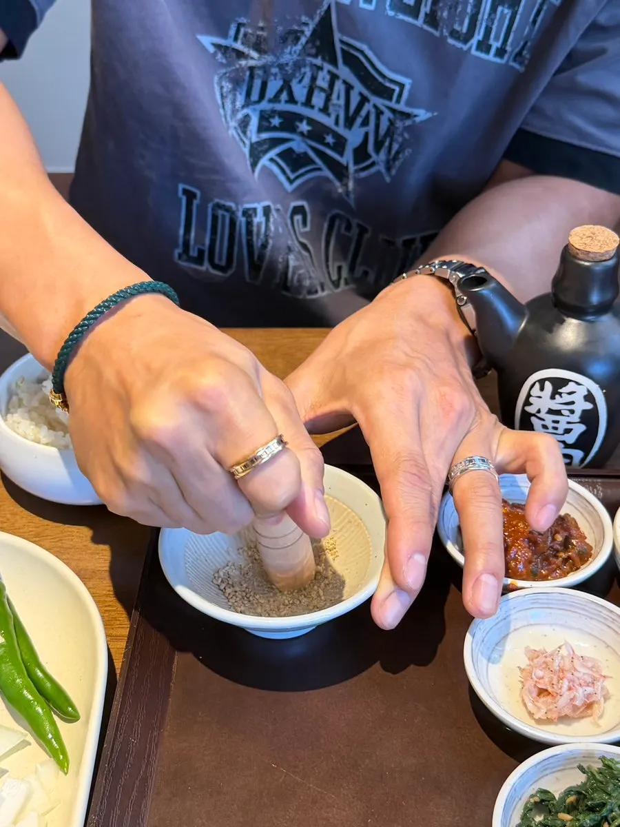 Sesame grinder and soy sauce on the table
