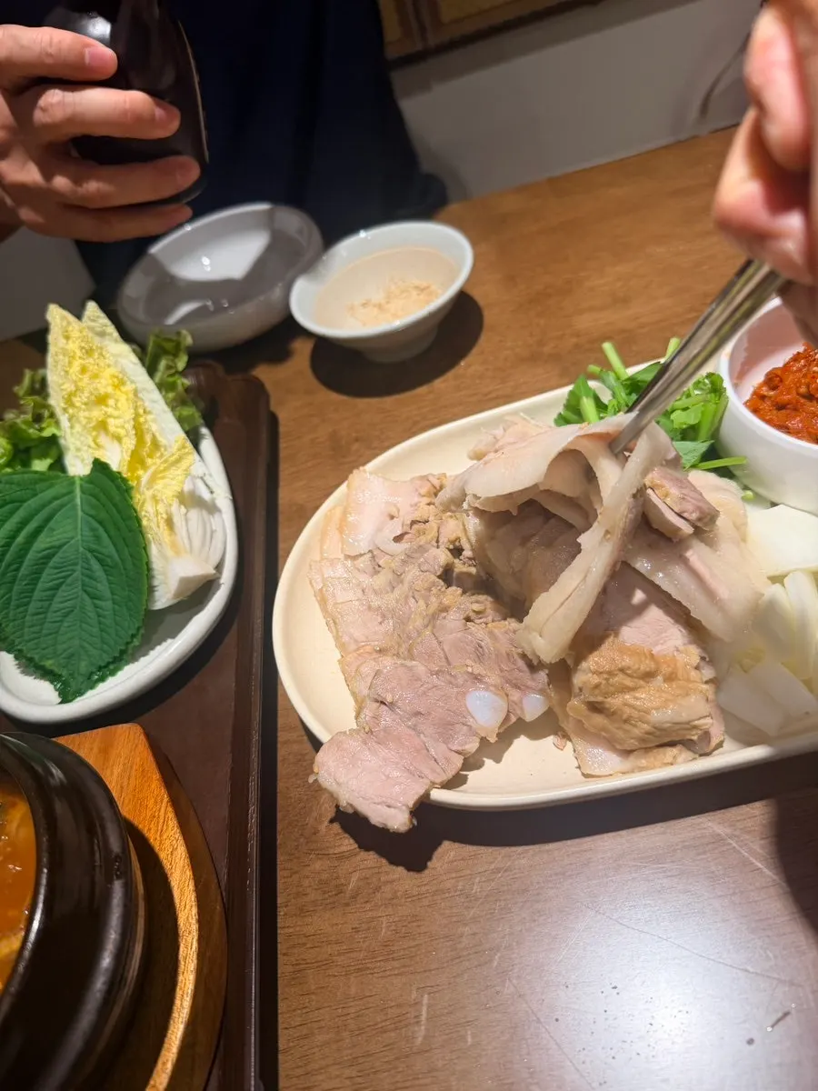 Close-up of Uldong Bossam pork and sesame soy sauce