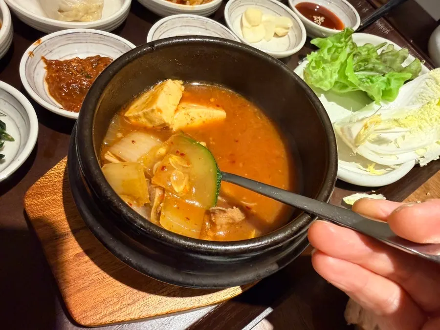 Uldong Bossam table spread with side dishes