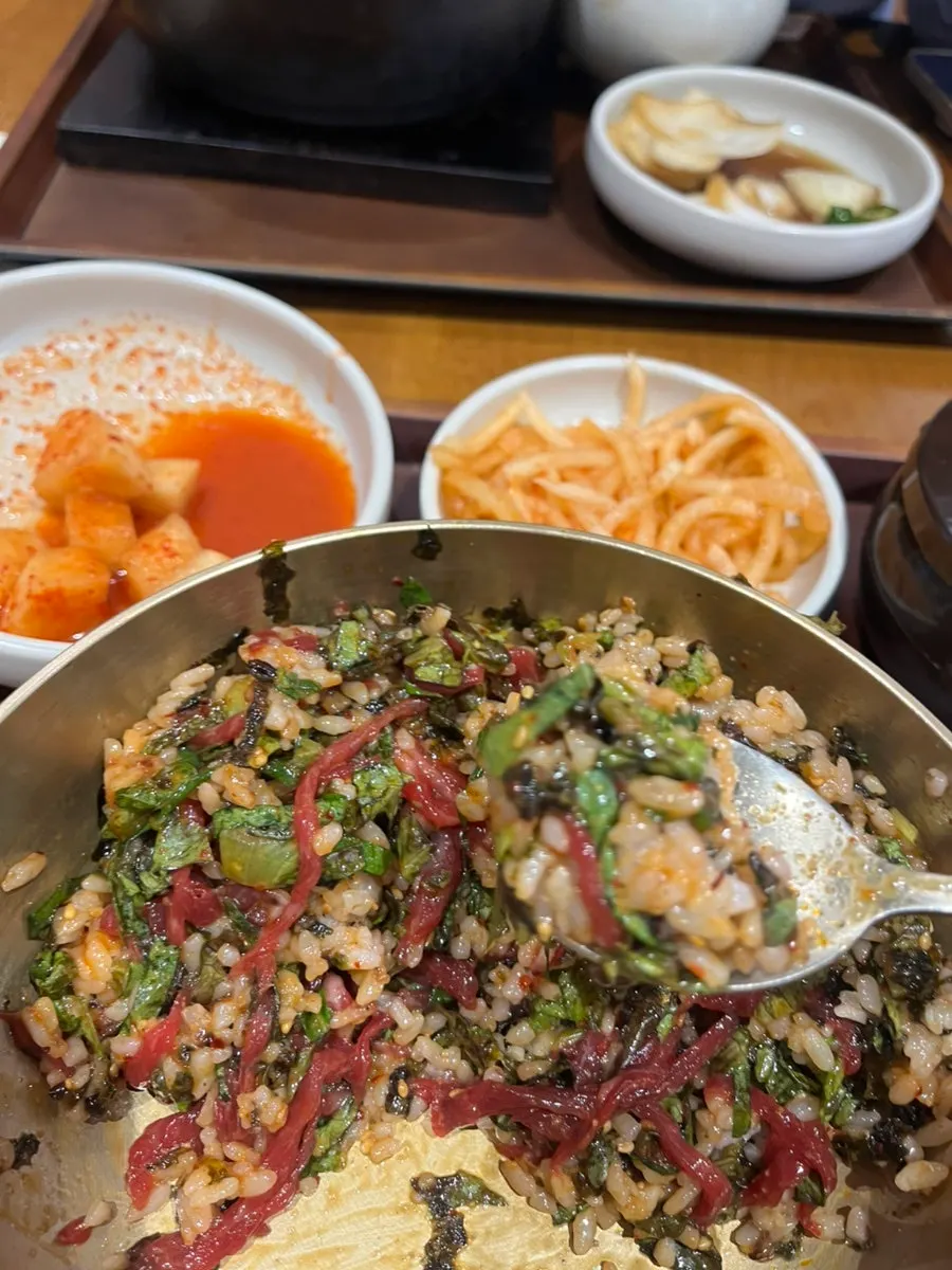Bibimbap mixed with vegetables and raw beef