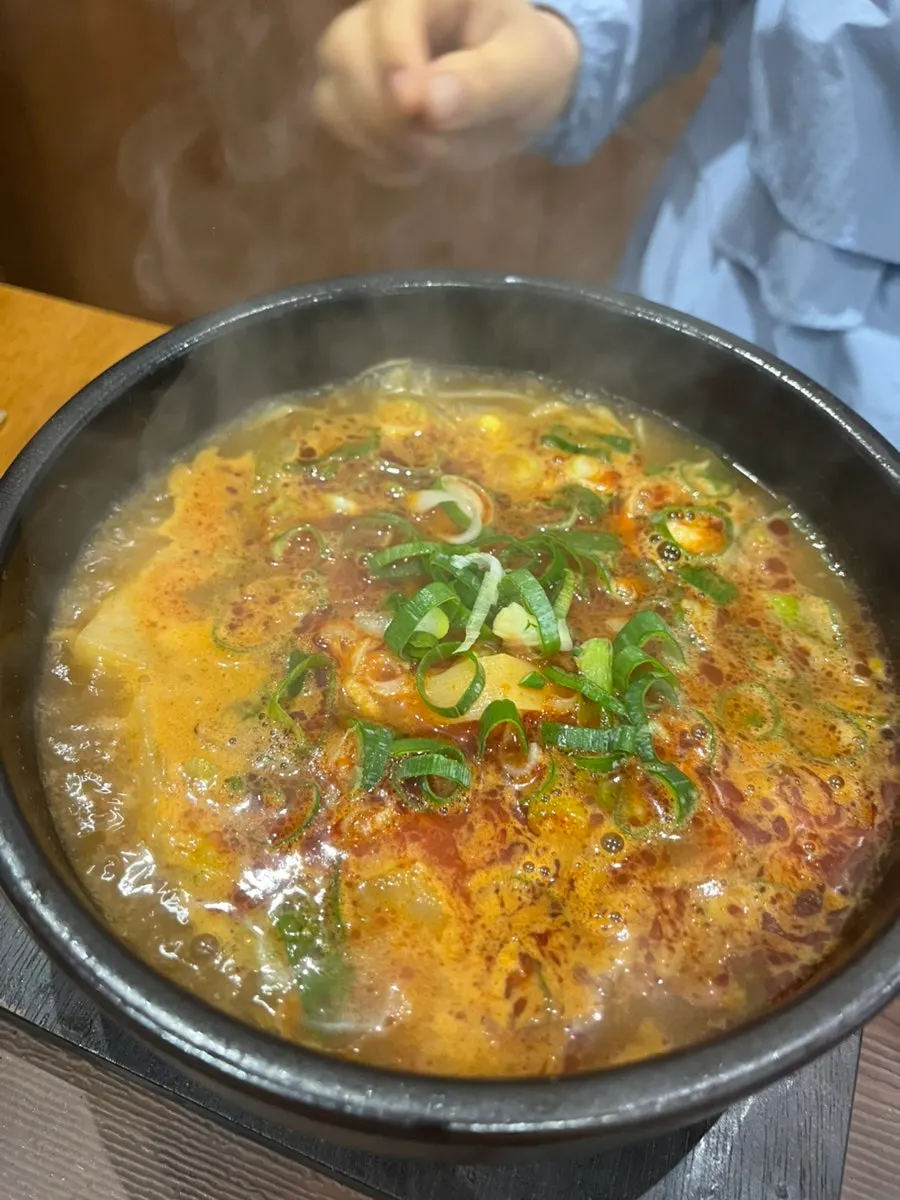 A full spread of Boksan haejangguk and yukhoe bibimbap