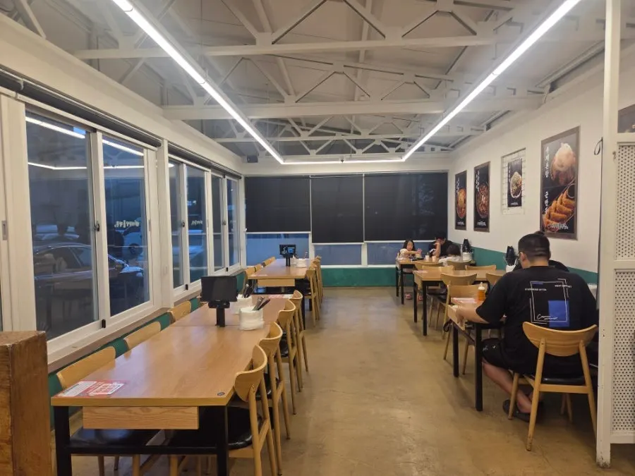 Interior of Ulsan Daewangam Dol Jjamppong with tables set up