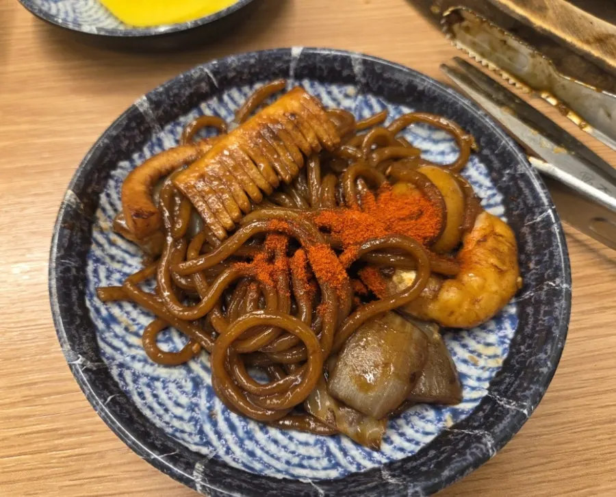Close-up of jjajang and seafood on the stone plate