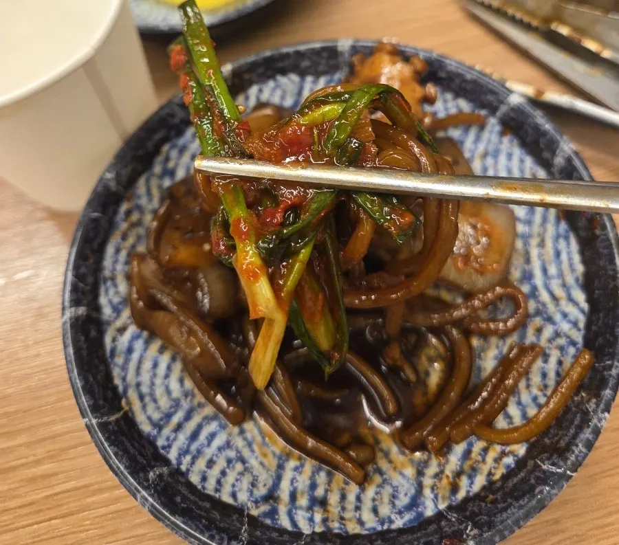 Stone-plate jjajang scooped onto a side plate