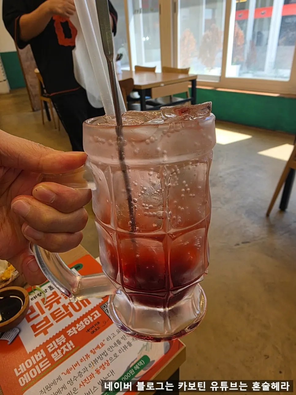 A glass of pomegranate homemade syrup ade