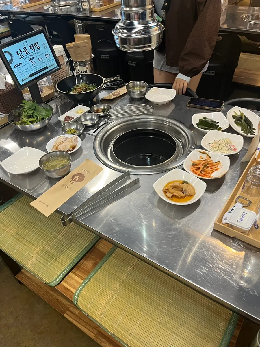 Reserved table already set up with meat before arrival