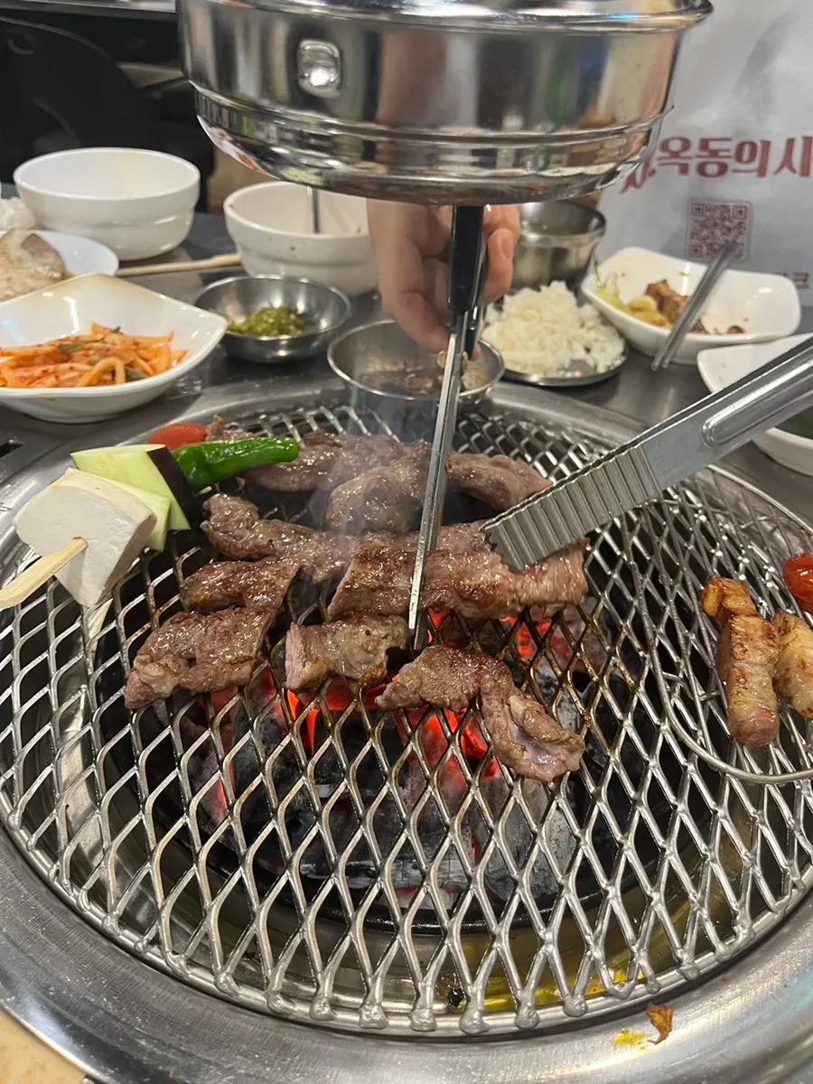 Close-up of galmaegisal cooking on the grill
