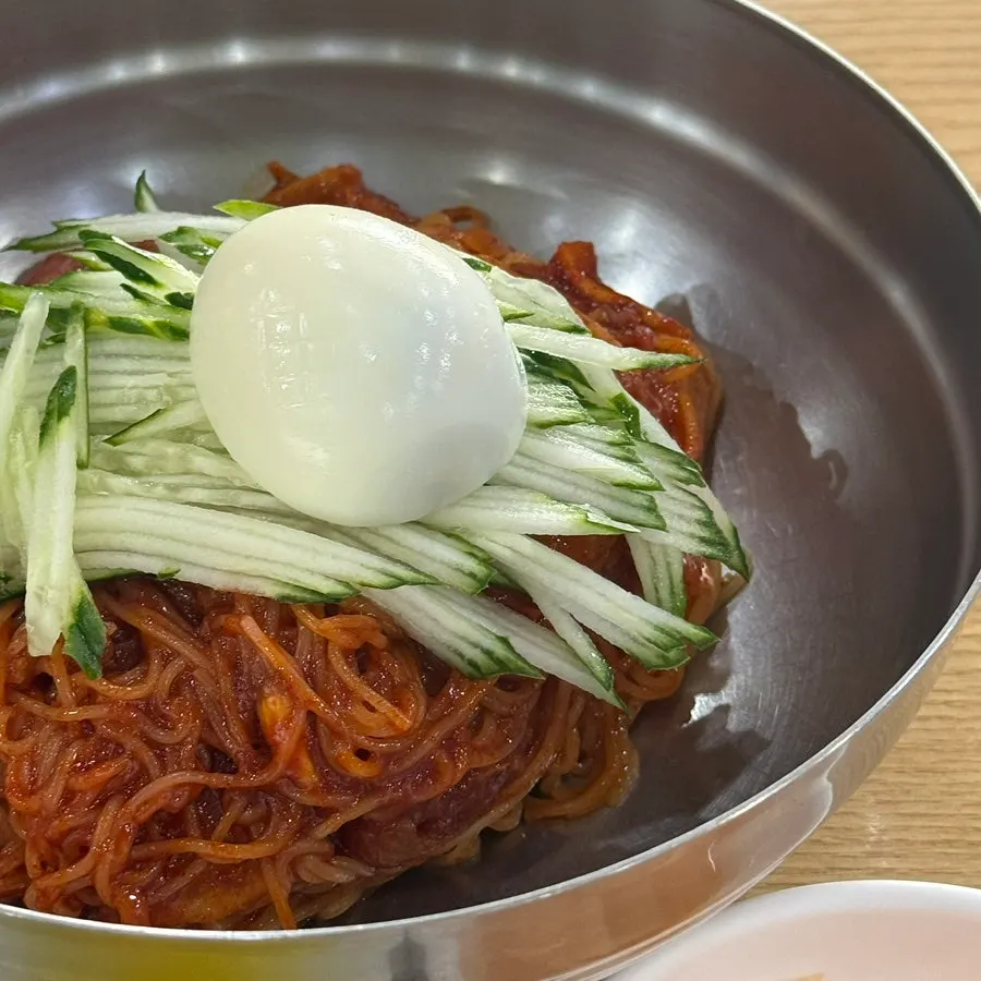 Bibim-milmyeon evenly coated with red sauce