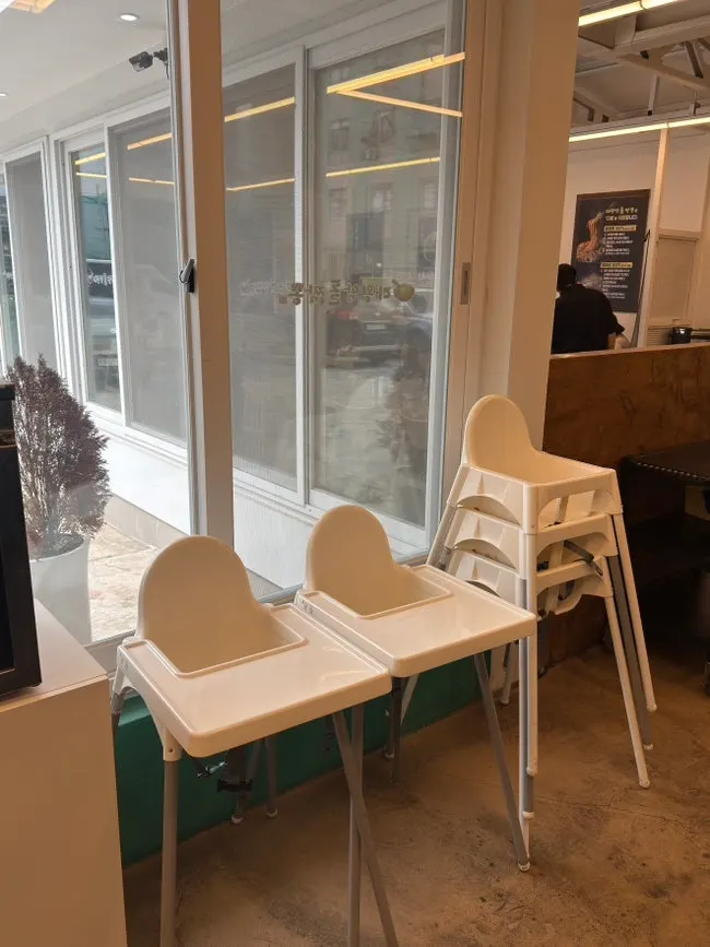 Baby-food microwave and kids' tableware storage in a corner of the shop