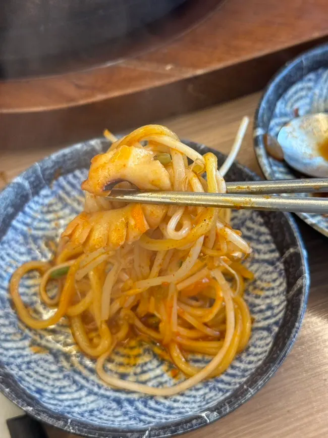 A bowl of dol jjamppong filled with seafood