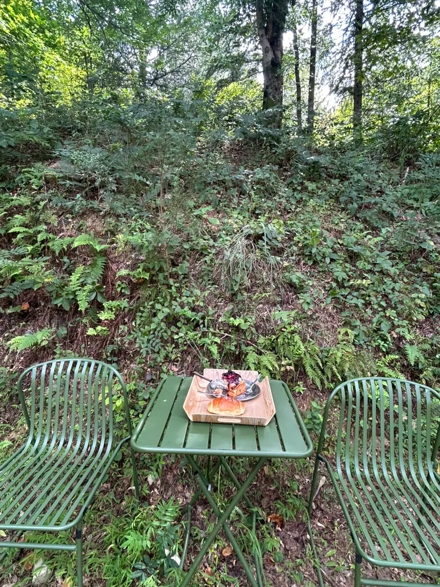 MUG's outdoor seating overlooking a pond