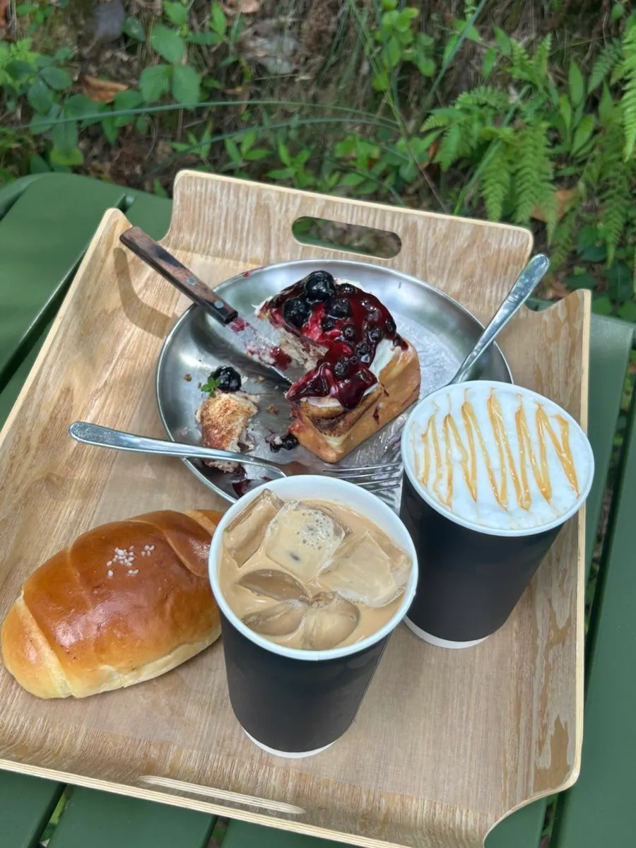 Two decaf iced lattes on an outdoor table