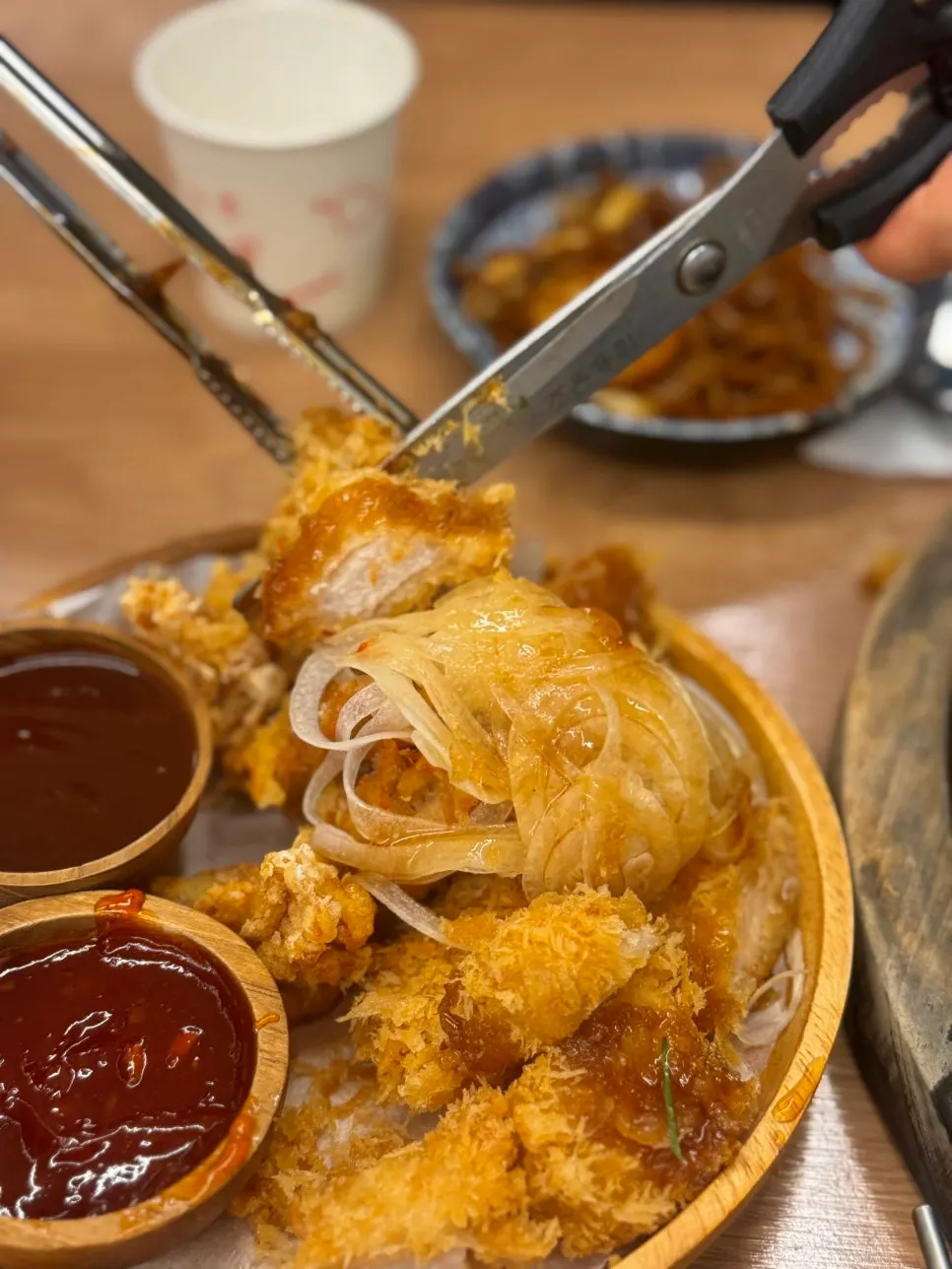 Dipping the dontang-chitang in soy sauce and chili sauce