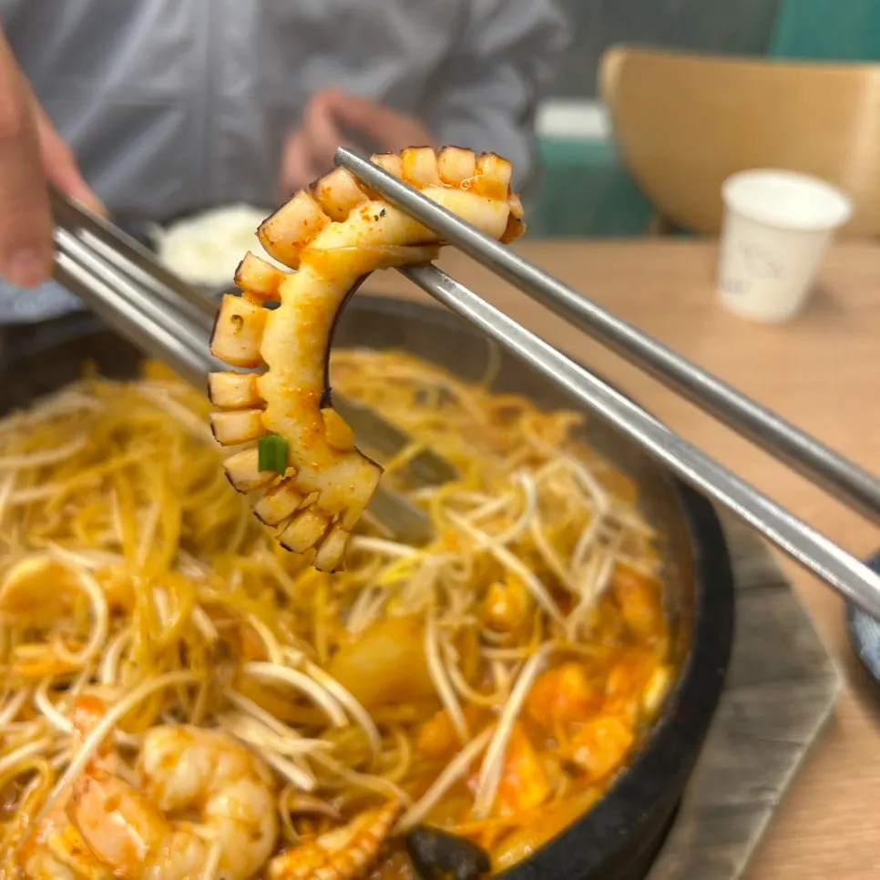 Stone jjamppong piled generously with bean sprouts and seafood