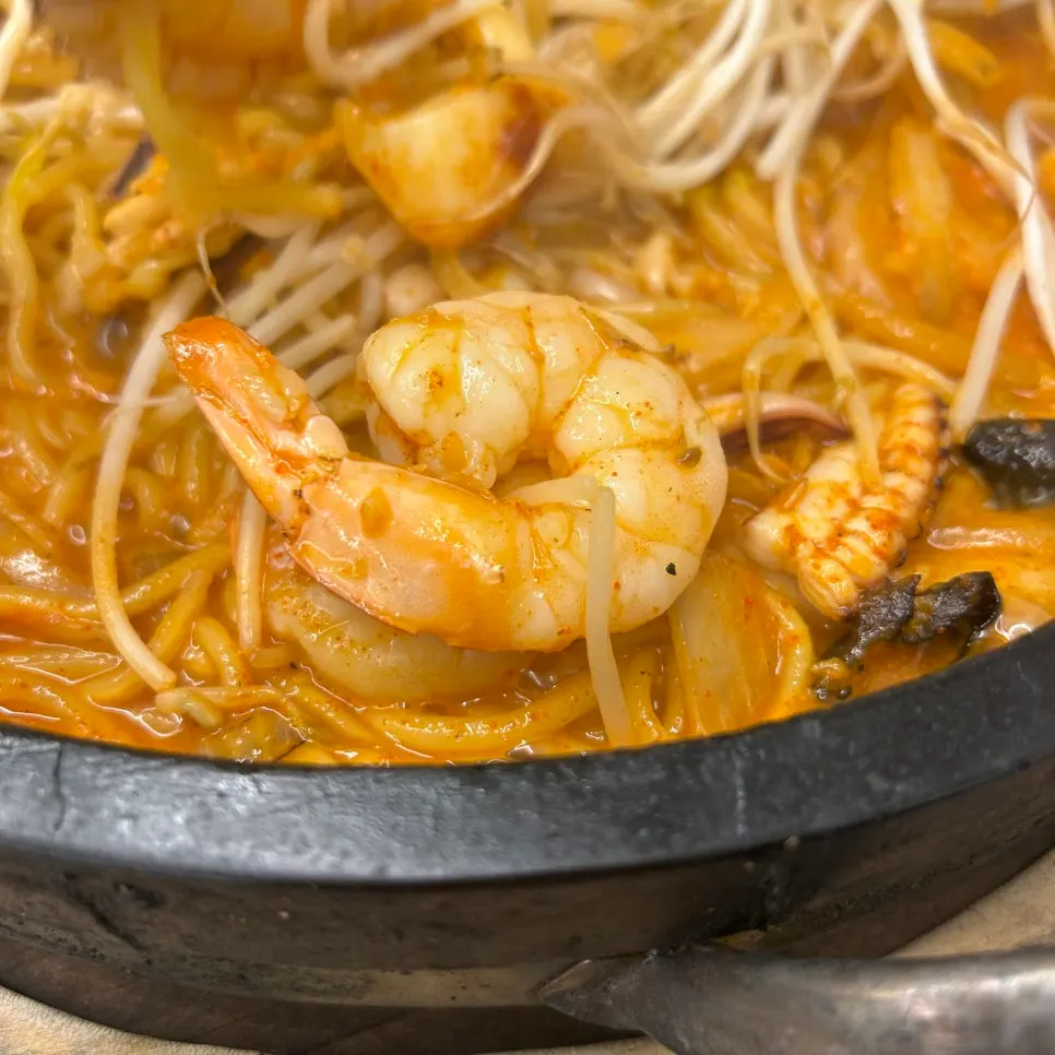 Stone jjamppong showing squid and vegetable toppings