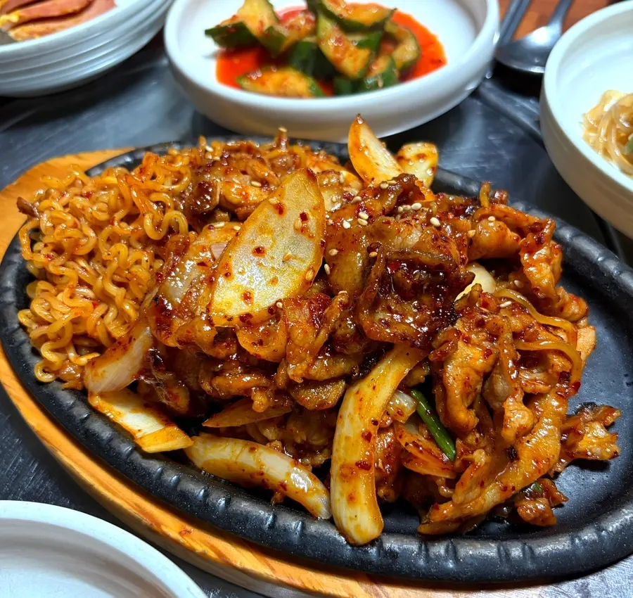 Spicy pork stir-fry served with ramen noodles
