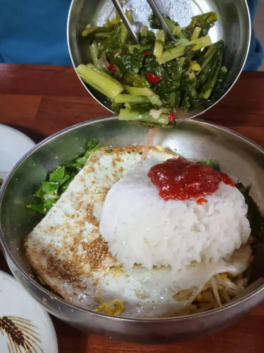 Yeolmu bibimbap topped with a fried egg