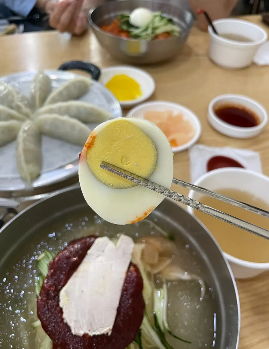 Double portion of bibim-milmyeon piled with cucumber