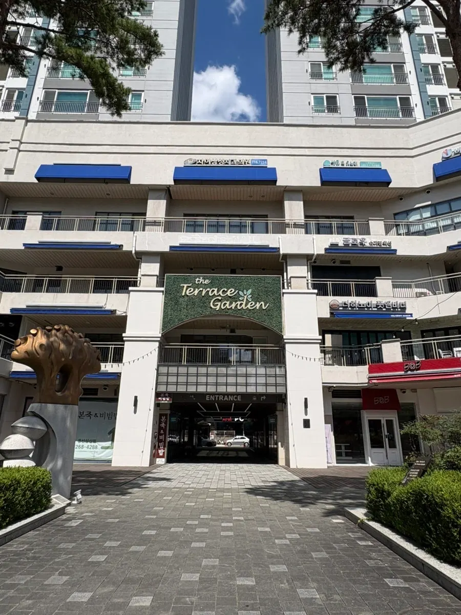 Full view of the Terrace Garden building with blue accents