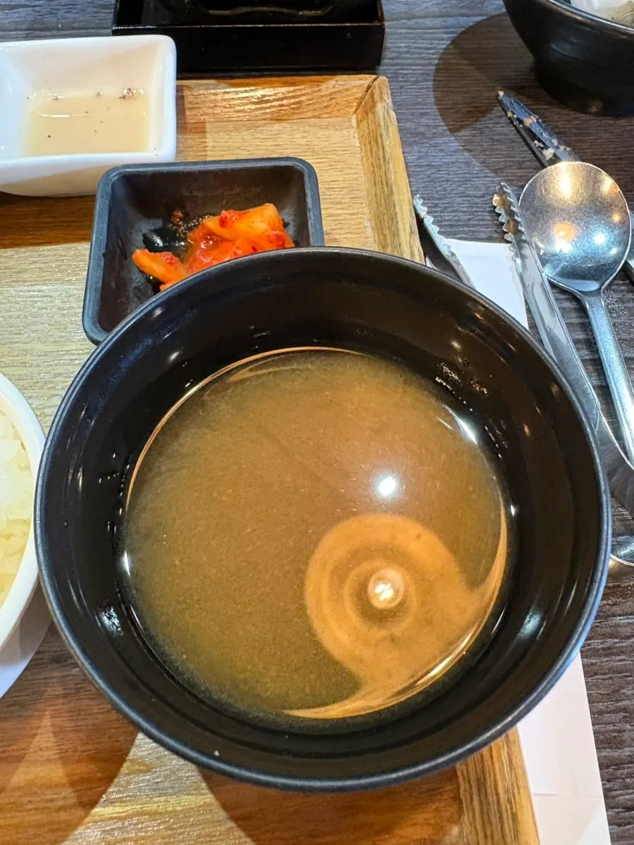 Clear broth and diced radish kimchi side dishes
