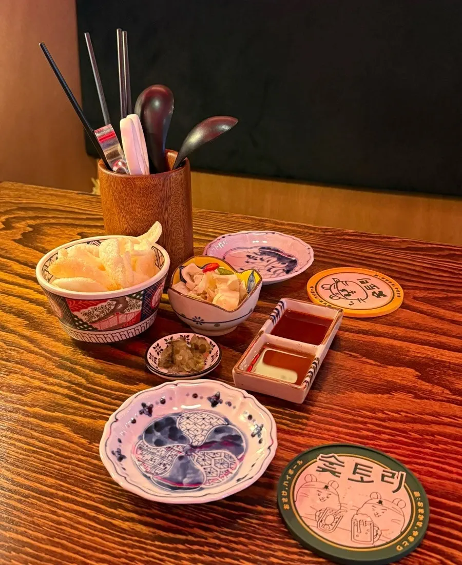 Complimentary pickled cabbage and shrimp roe chips