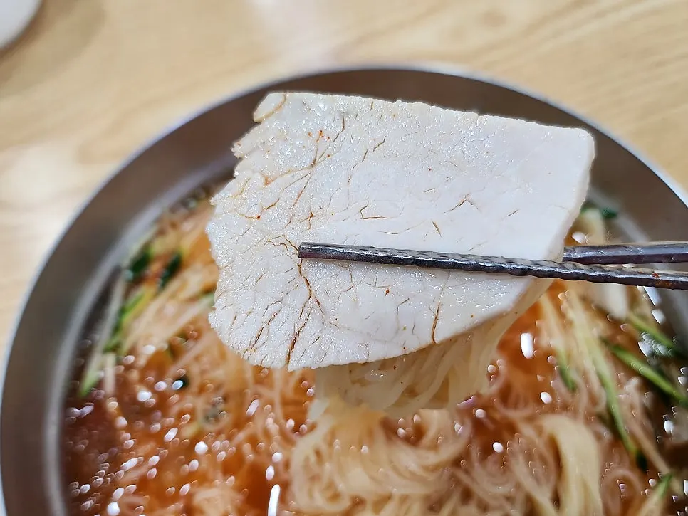 Beef and egg served with water milmyeon