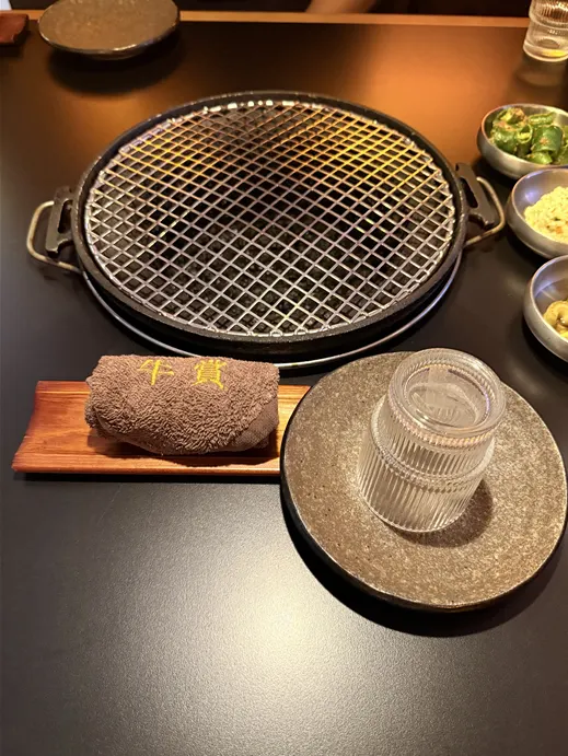 Small plates and wet towel set up at the reserved table