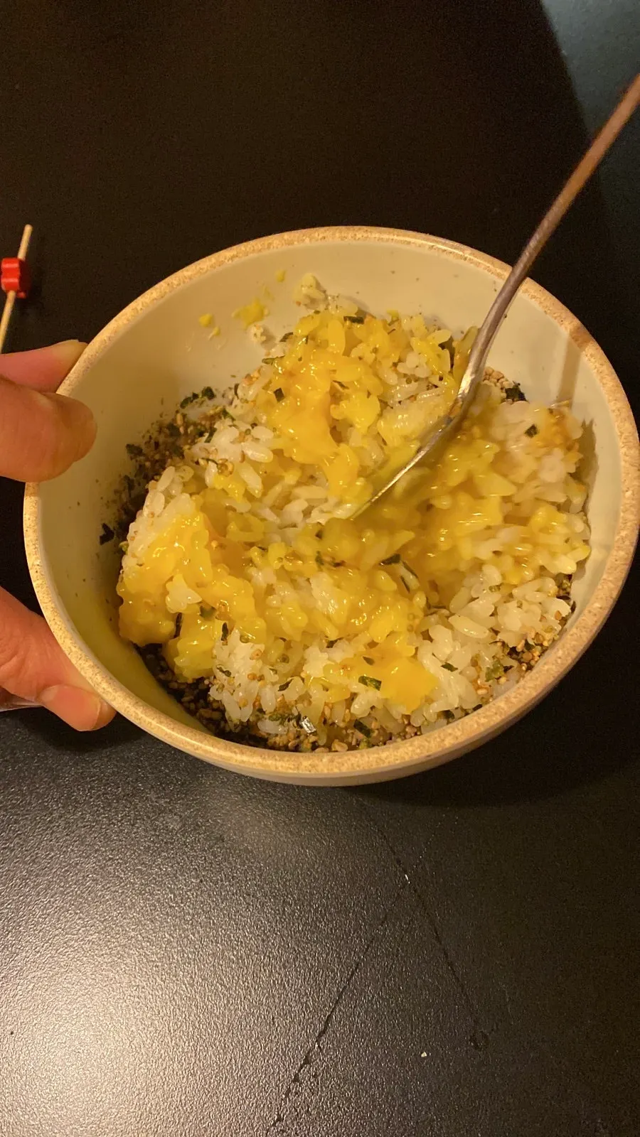 Soy sauce egg rice mixed with the burst yolk