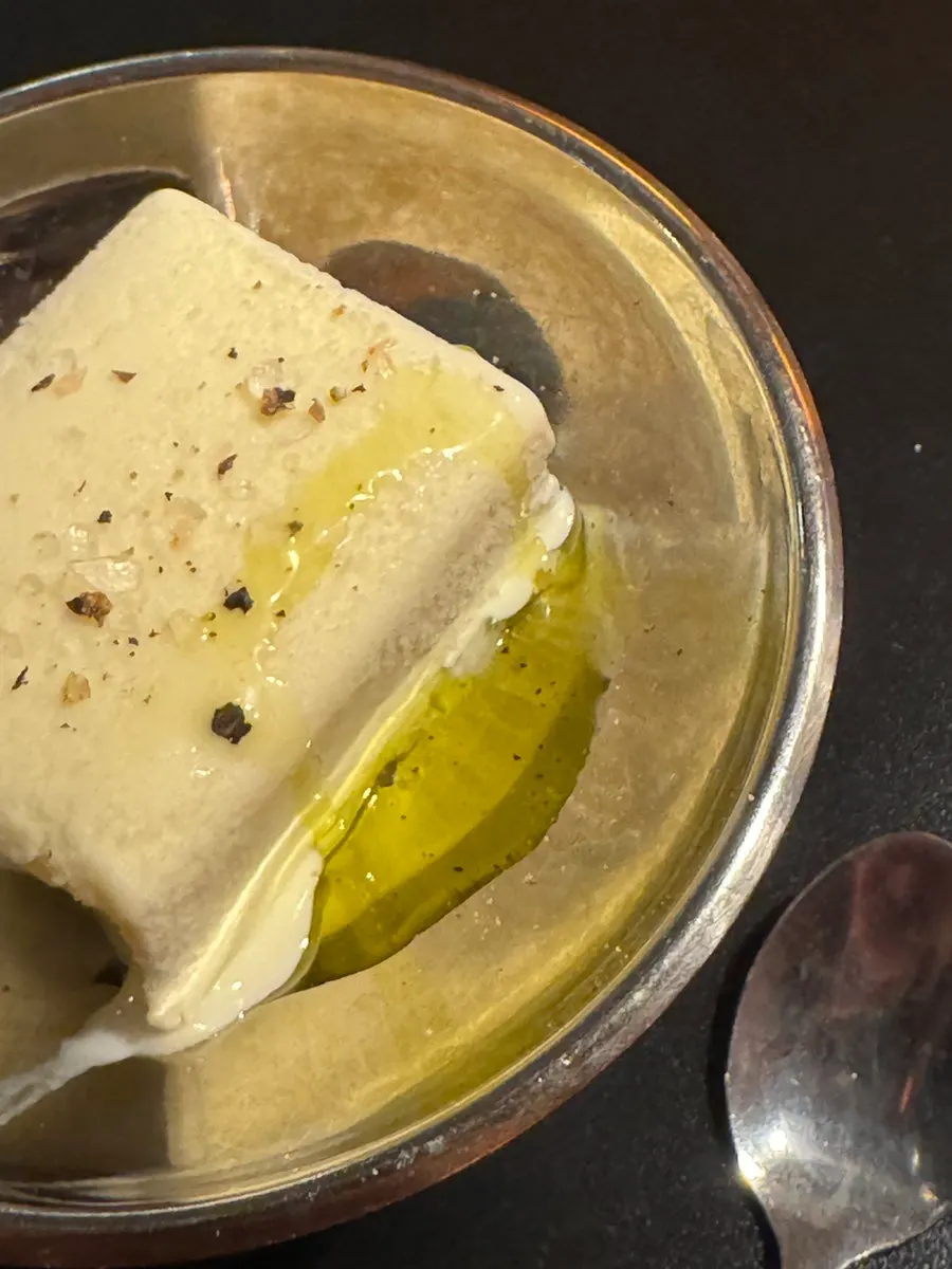 Ice cream topped with olive oil, pepper, and salt
