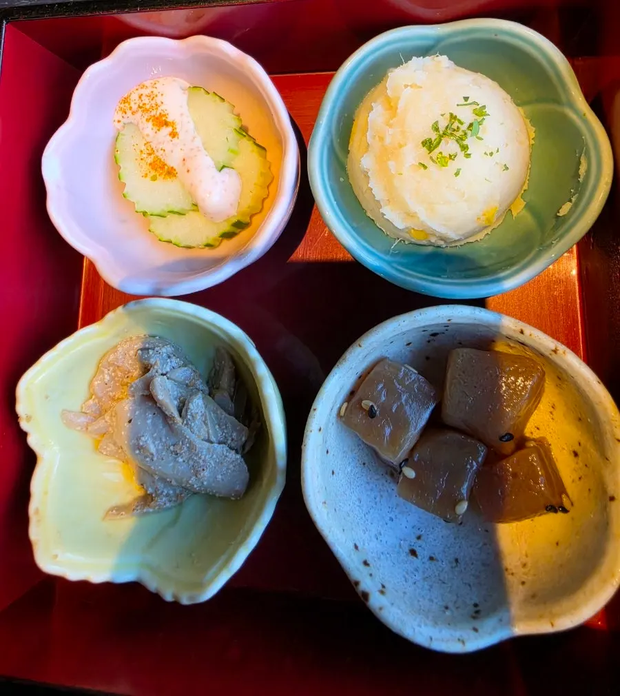 Basic banchan including cucumber salad and simmered konjac
