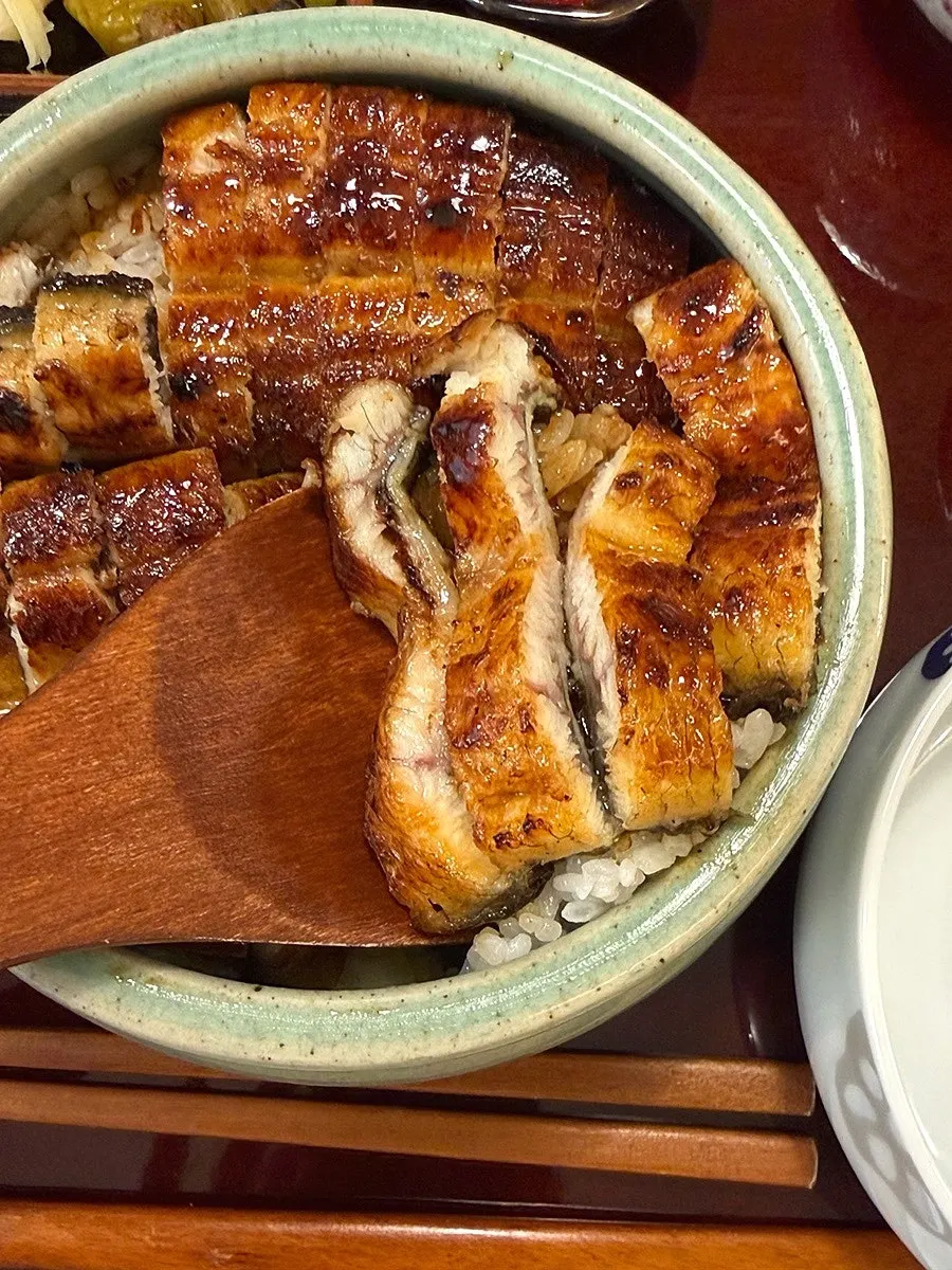 First serving of the eel rice bowl divided into quarters