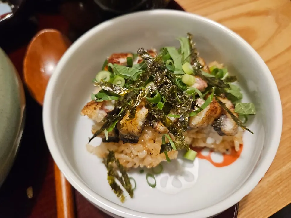 Second combination topped with seaweed flakes, perilla, scallion, and wasabi