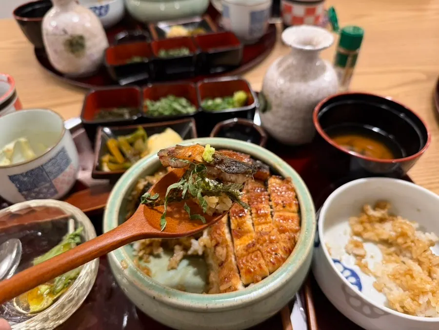 Hitsumabushi divided into four portions with perilla leaf and wasabi on top