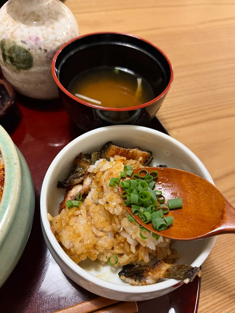Eel rice bowl topped with scallion and wasabi