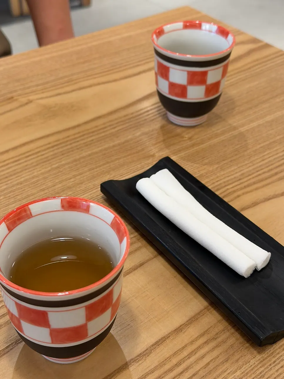 Water cup and wet wipe holder provided at the table