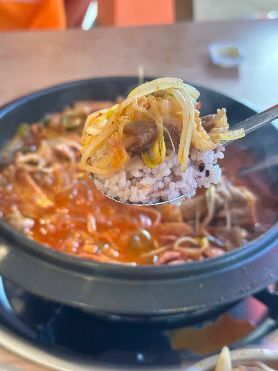 Toppings scooped up from the jjamppong budae jjigae pot