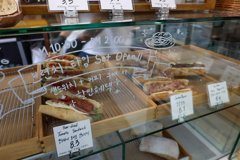 Oven and work counter visible behind the showcase