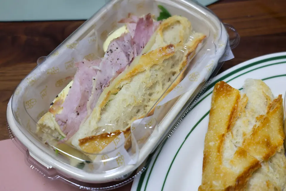 Jambon-beurre baguette sandwich with multiple layers of ham