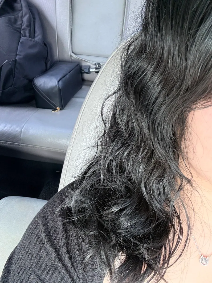 Toned-down style finished with blow-drying
