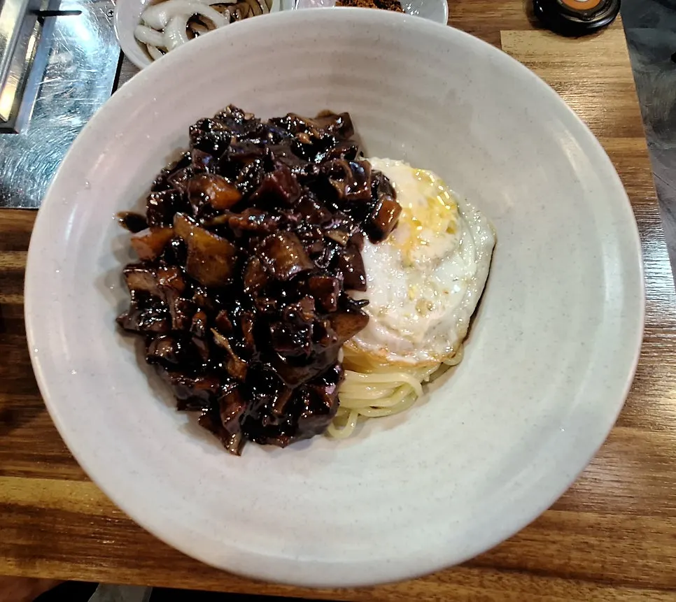 A bowl of ganjjajang mixed and ready to eat