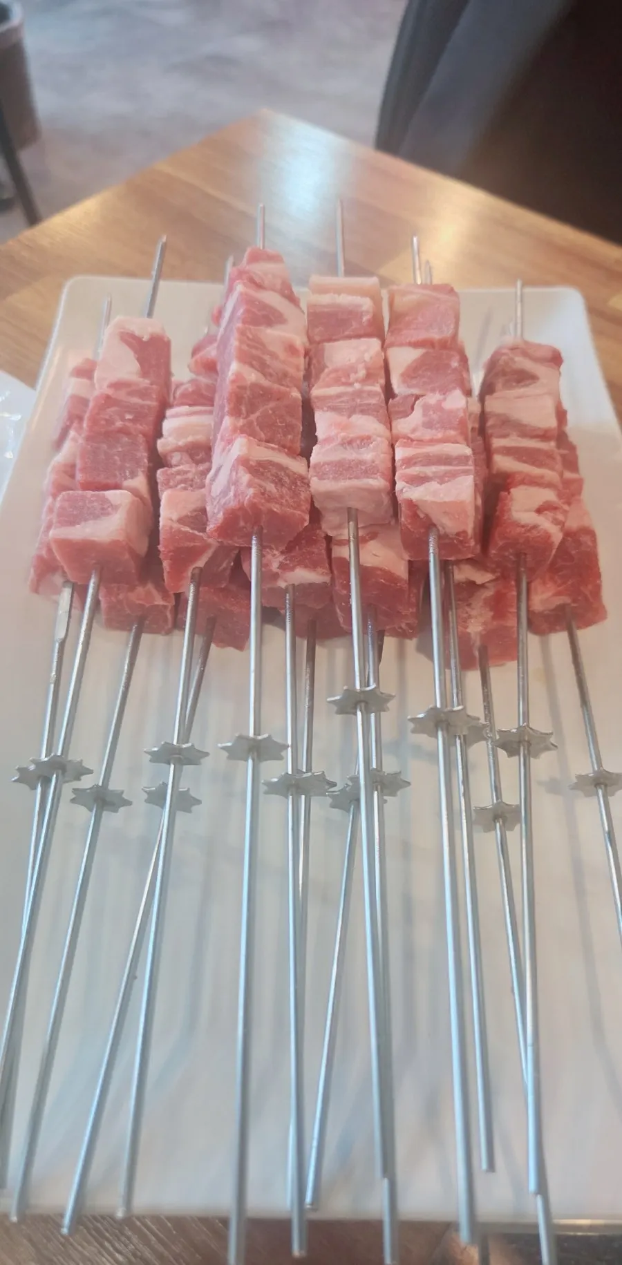 A plate of 2 servings, 16 lamb skewers