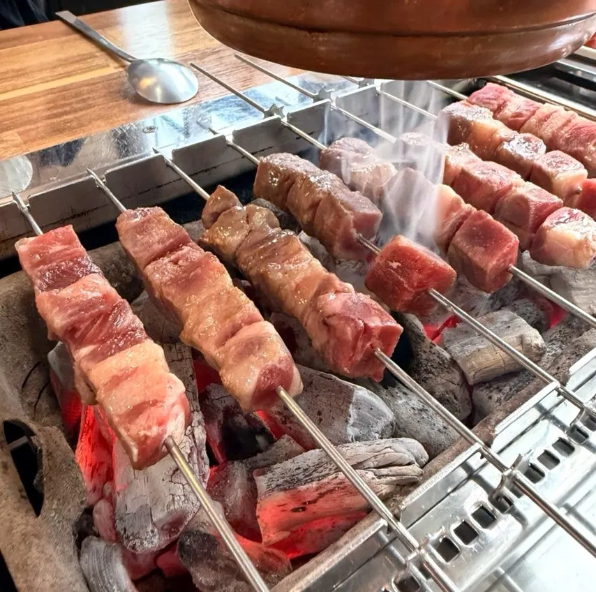 Two rounds of lamb skewers (8 each) with chive egg stir-fry at a Paju Unjeong restaurant, Sannaemaeul Yang Kkochi & Qingdao