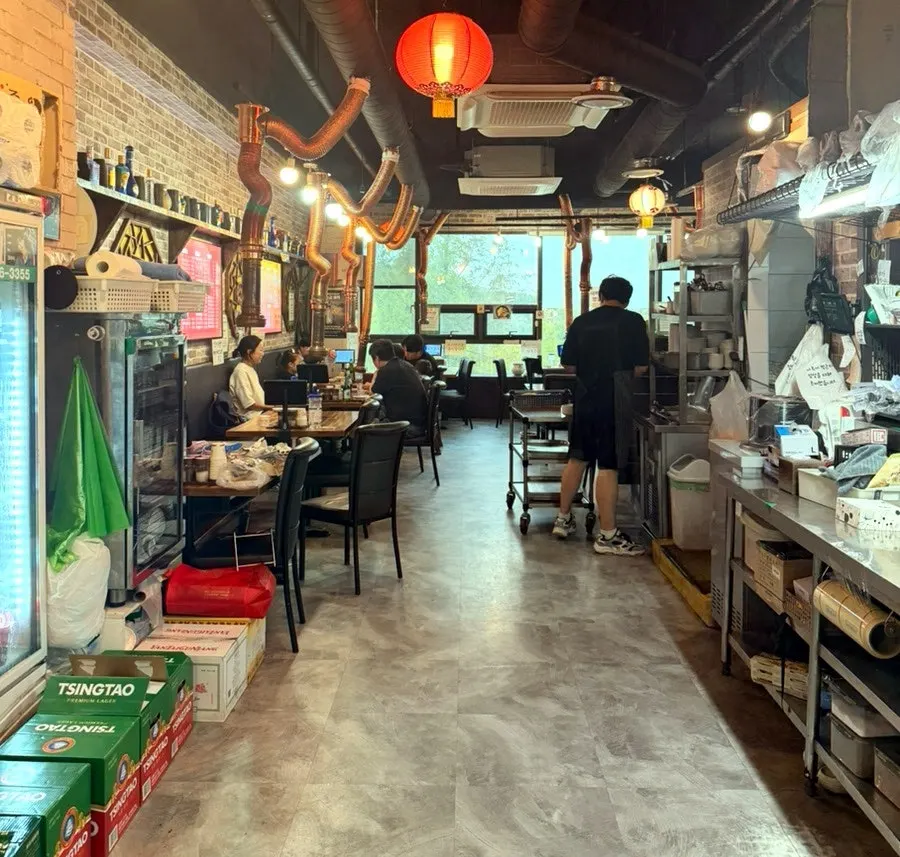 View of the lamb skewer restaurant in the Sannae-maeul commercial area